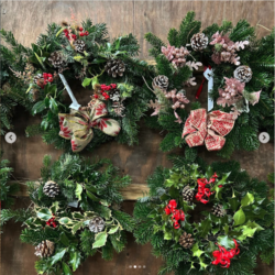 Christmas wreaths with different styles of ornaments and ribbons